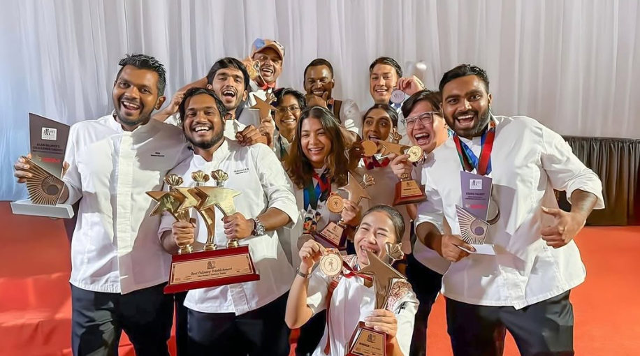 The dusitD2 Feydhoo Maldives culinary team celebrating with medals and trophies at Hotel Asia 2025